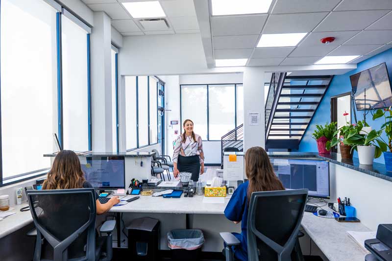 Patient applying for financing at the front desk of Diamond Dental Group in Denver CO. 
